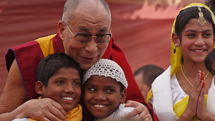 His Holiness the Dalai Lama with young children during the inauguration of the Tong Len hostile in Dharamsala, HP, India on November 19, 2011. (Photo by Tenzin Choejor/OHHDL)