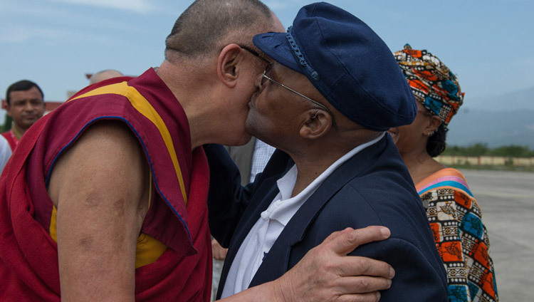 His Holiness the Dalai Lama exchanging greetings with his old friend Archbishop Desmond Tutu on the Archbishop's arrival at the airport in Dharamsala, HP, India on April 18, 2015. (Photo by Tenzin Choejor/OHHDL)